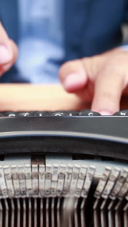 Businessman-typing-on-typewriter