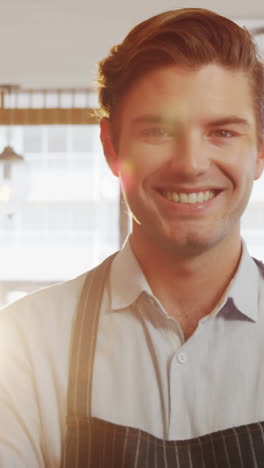 Portrait-of-waiter-smiling-at-camera