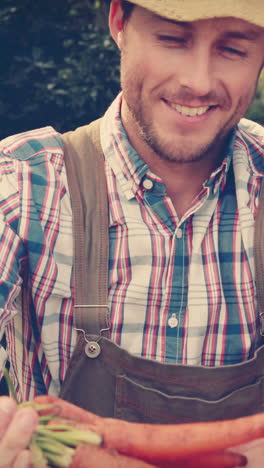 Happy-farmer-showing-his-products