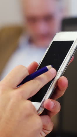 Businessman-using-mobile-phone