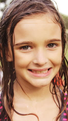 Portrait-of-girl-smiling-in-garden