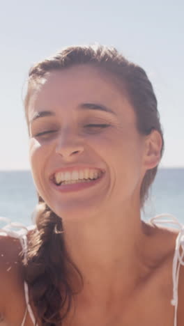 Woman-blowing-a-kiss-in-front-of-her-smartphone-