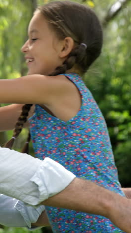 Mature-man-hugging-his-granddaughter