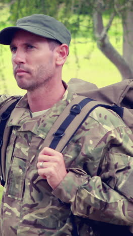 Serious-soldier-looking-away-with-hand-on-forehead-