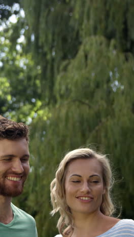 Young-couple-taking-a-picture-with-their-smartphone