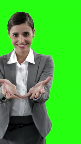 Businesswoman-gesturing-against-green-screen