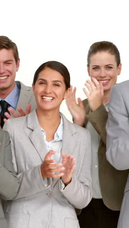 Business-people-applauding-in-front-of-camera