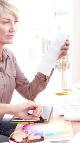 Casual-designer-working-at-her-desk