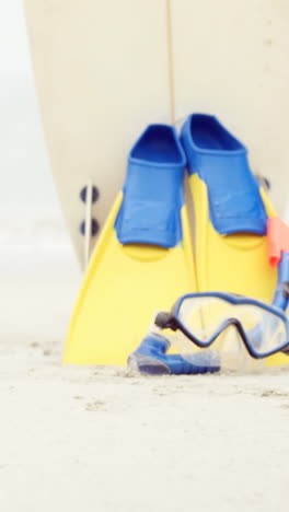 View-of-snorkeling-equipment-and-surfboard