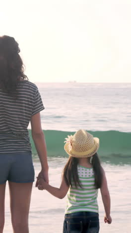 Family-on-holidays-looking-at-the-sea