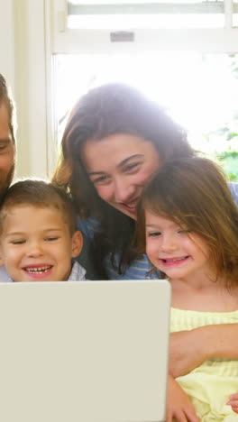 Family-looking-at-the-tablet-computer