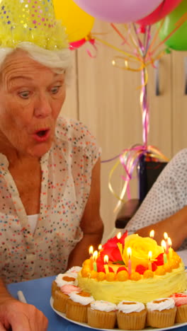 Senior-woman-celebrating-her-birthday-with-friends