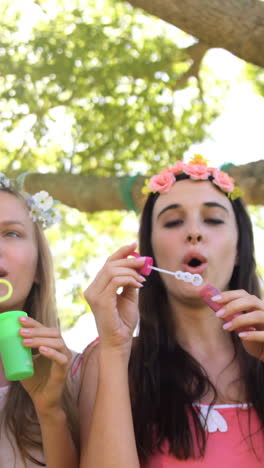 Three-hipster-friends-doing-soap-bubbles