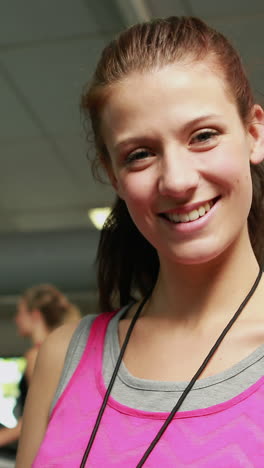 Female-trainer-smiling-to-camera