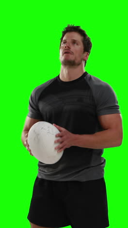 Serious-rugby-player-with-ball