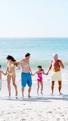 Three-smiling-generation-family-dancing-together