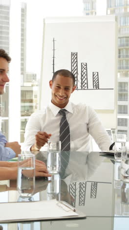 Business-people-shaking-hands-at-a-meeting