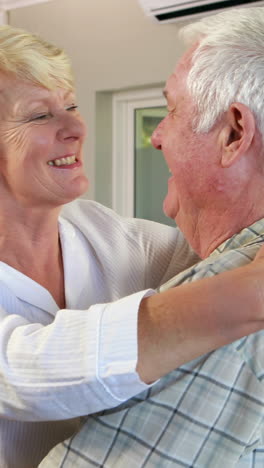 Happy-senior-couple-dancing-together