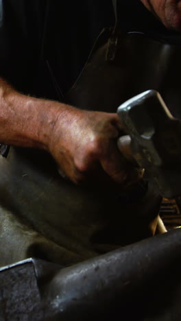 Blacksmith-working-on-a-iron-rod