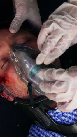 Emergency-medical-technician-posing-an-oxygen-mask