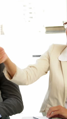 Businesswomen-shaking-hands-at-interview