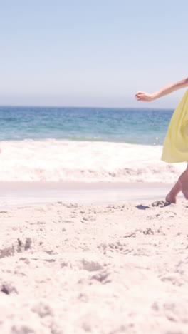 Family-running-on-the-beach