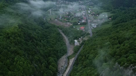 Aerial-View-Over-Village-Houses-In-The-Valley-On-A-Misty-Day-In-Lepsa,-Vrancea,-Romania---Drone-Shot