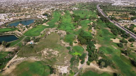 An-aerial-view-of-a-golf-course-with-many-trees-and-green-grass-from-above-at-Tunisia-Djerba