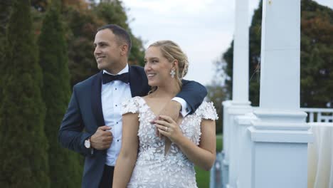 Bride-and-groom-pose-dramatically-at-luxury-hotel