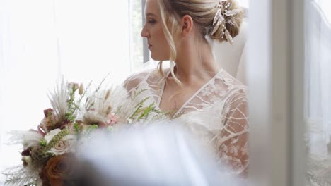 Bride-smiles-in-her-robe-early-in-the-morning