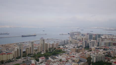 Shot-of-Gibraltar-Port-with-a-town-and-seascape-at-background-in-England