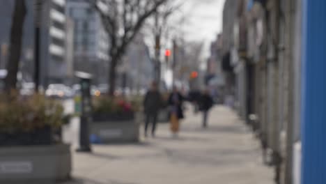 empty-Toronto-Danforth-Village-sidewalk-ppl-slow-walking