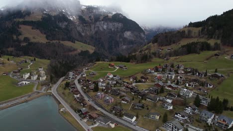 Aerial-View-of-Scenic-Engelberg-Town-Buildings-and-Landscape-of-Swiss-Alps,-Drone-Shot