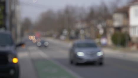 quiet-local-street-car-approaching-intersection