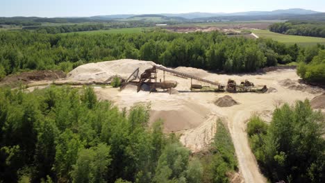 An-Old-Sand-Mine-Nestled-in-the-Heart-of-a-Lush-Green-Landscape-Near-the-Town-of-Prudnik,-Poland---Aerial-Drone-Shot