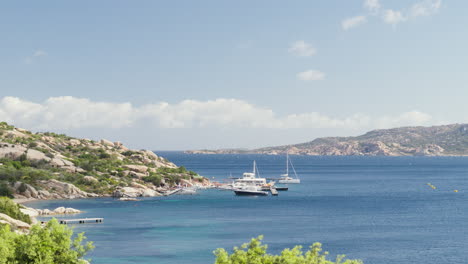 Serene-Sardinian-coast-with-yachts-and-clear-blue-water