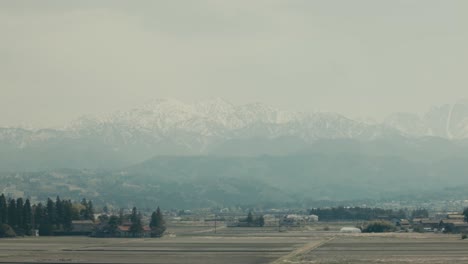 Snow-covered-Mountain-Tateyama-In-Fog-Seen-From-Toyama-Prefecture-In-Japan