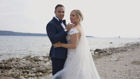 Bride-and-groom-pose-on-beach