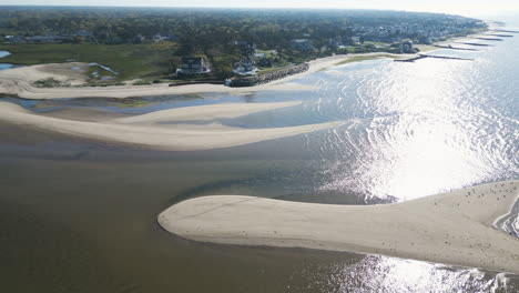 Scenic-morning-aerial-view-of-Dennis-Port,-Nantucket-Sound,-Massachusetts,-with-shimmering-waters