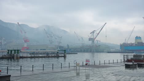 Rain-over-Harbor-of-Kure,-Hiroshima-Prefecture,-Japanese-Shipyards