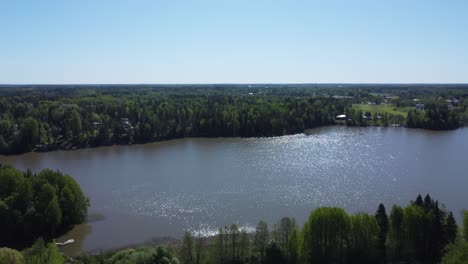 Copy-space-blue-sky-horizon-on-sparkling-blue-northern-boreal-lake