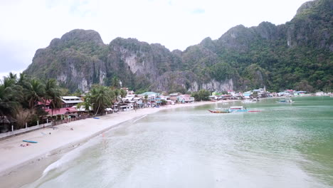 Dolly-down-beach-front-over-ocean