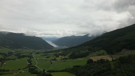 Aerial-Upwards-Panning-Shot-Showing-the-Scenic-Landscape-of-Vikøyri,-Vik-i-Sogn,-in-Norway