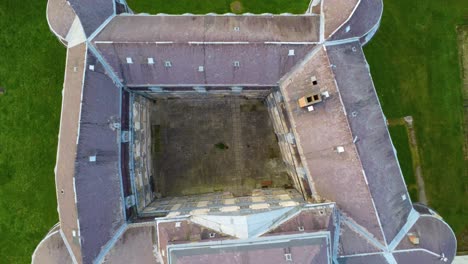 Aerial-view-of-medieval-Güssing-Castle-in-Burgenland,-Austria,-drop-down