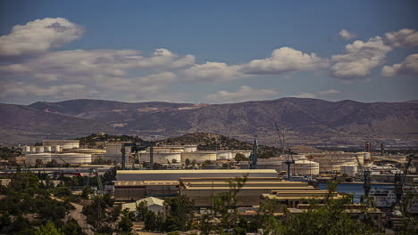 Timelapse-shot-of-cloud-moving-over-Elefsina-Harbor-and-Hellenic-Petroleum-Industrial-Site-in-Athens,-Greece-on-a-cloudy-day