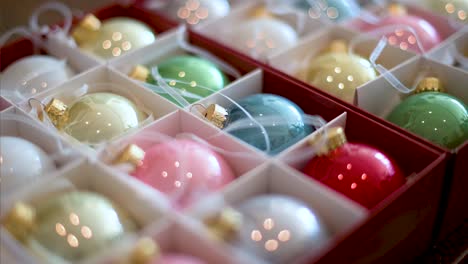 Narrow-focus-on-shiny-colorful-Christmas-tree-balls-arranged-in-a-box