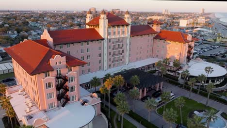 Aerial-view-around-the-Grand-Galvez-hotel,-sunset-in-Galveston-Island,-Texas,-USA