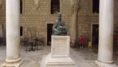 Closing-up-to-a-statue-of-Miho-Pracat-at-the-Rector's-Palace-in-Dubrovnik,-Croatia,-highlighting-the-rich-cultural-heritage-and-historical-significance-of-this-landmark