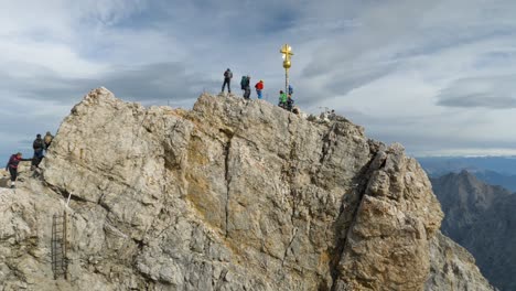 People-climbing-Zugspitze-Summit-in-the-Alps,-Bavaria,-Germany