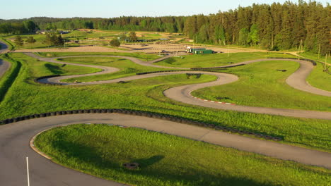 Scenic-Aerial-Shot-of-Smiltene's-Go-Kart-Racing-Track-during-Golden-Hour